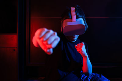 Gamer man wearing virtual reality goggles