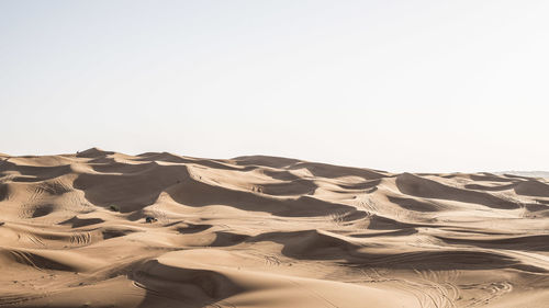 Scenic view of desert against clear sky