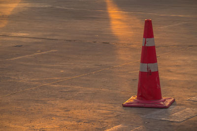 High angle view of fire hydrant on road at sunset