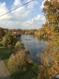 Scenic view of river against sky during autumn