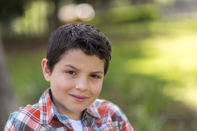 Close-up portrait of boy at park