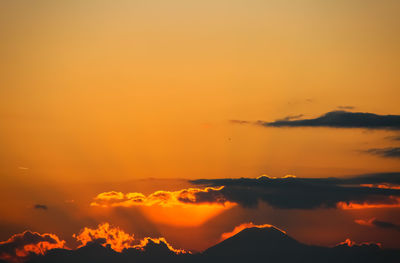 Scenic view of dramatic sky during sunset