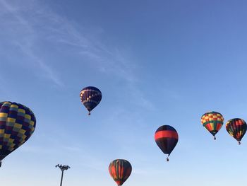 Low angle view of hot air balloons against sky