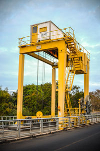 View of yellow bridge against sky