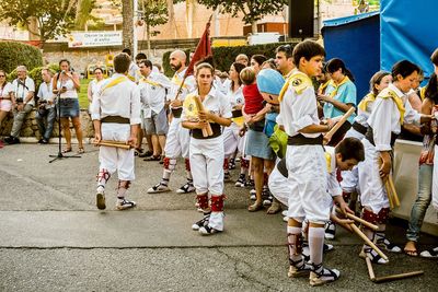 People walking on street during festival