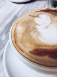 Close-up of cappuccino on table