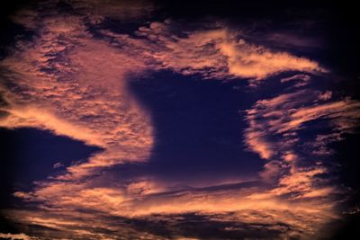 Low angle view of dramatic sky during sunset