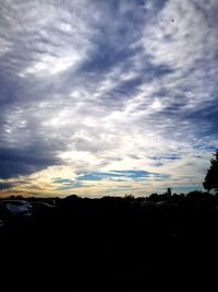 Silhouette landscape against sky during sunset