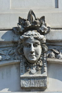 Low angle view of statue against building