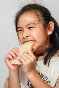 Close-up of woman eating food
