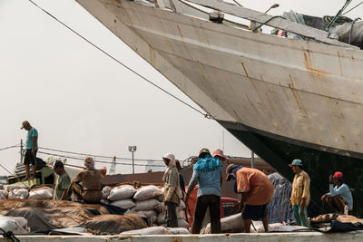 Manual workers working at harbor