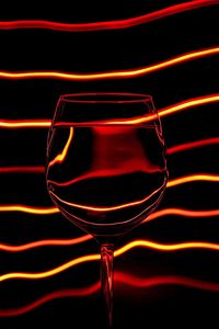 Close-up of red object over black background