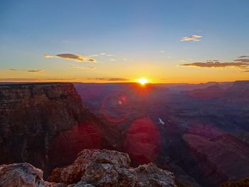 Scenic view of rock formation against sky during sunset