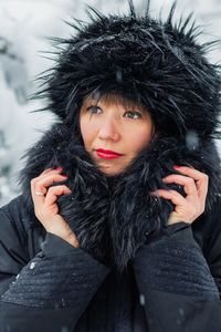 Portrait of woman wearing hat during winter