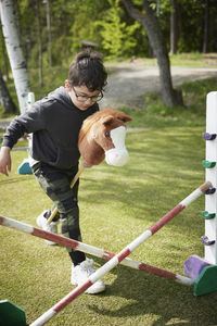 Boy participating in hobby horse competition