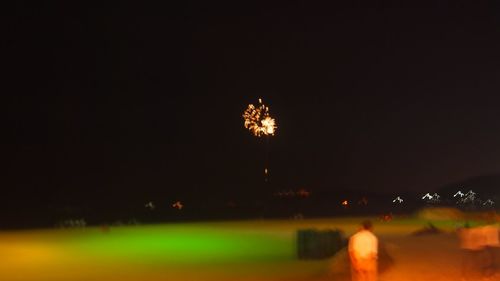 Low angle view of illuminated sky at night