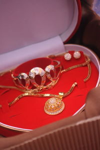 High angle view of jewelry in box