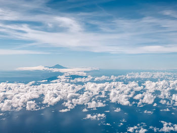 Aerial view of cloudscape over mountain