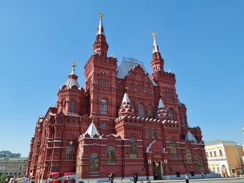 Low angle view of temple building against clear blue sky
