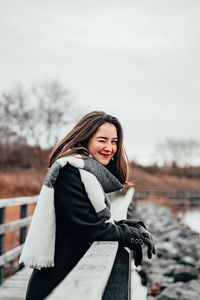 Woman standing in snow