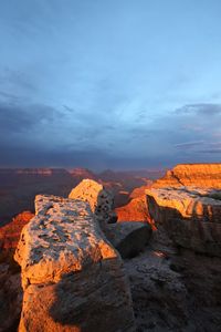 Rock formations against sky during sunset