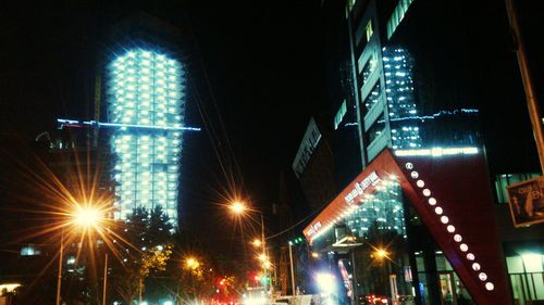 Low angle view of illuminated street light at night