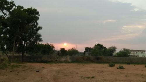 Scenic view of landscape at sunset