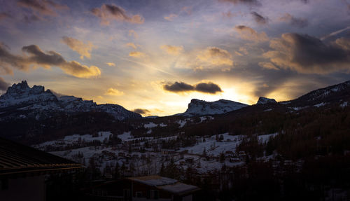 A scenic view of the town with mount ra gusela and averau at sunset, in cortina d'ampezzo, italy