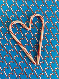 Candy cane heart shape  on  candy cane background