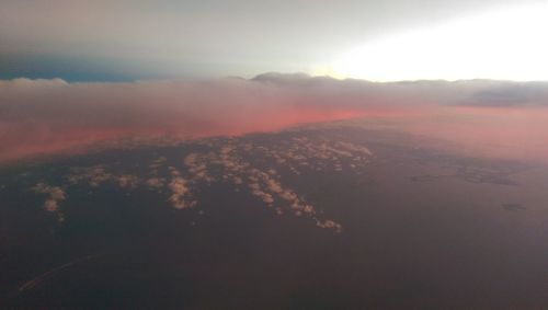 Aerial view of landscape against cloudy sky