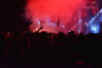 Silhouette of people at music concert