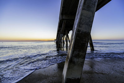 Scenic view of sea against clear sky at sunset