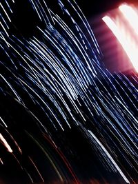 Light trails against sky at night