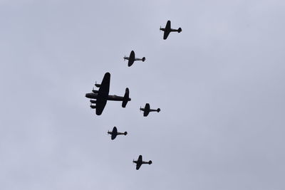 Low angle view of airplane flying in sky