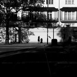 Man walking on road in city