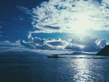 Silhouette of boat sailing on sea