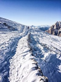 Scenic view of snowcapped mountain against clear sky