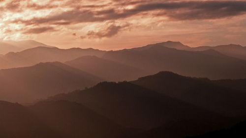 Scenic view of mountains against sky during sunset