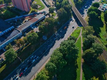 High angle view of street amidst trees in city