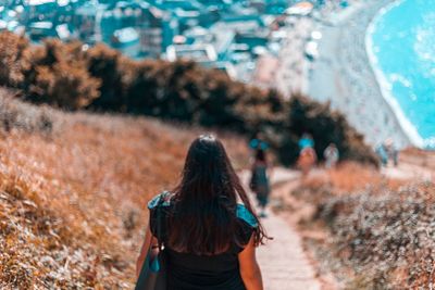 Rear view of woman walking outdoors