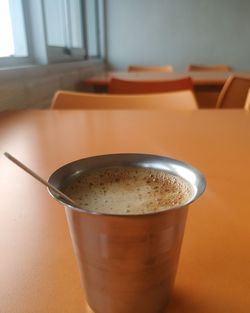 Close-up of cappuccino on table