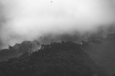 Scenic view of mountains in foggy weather