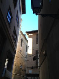 Low angle view of buildings against blue sky