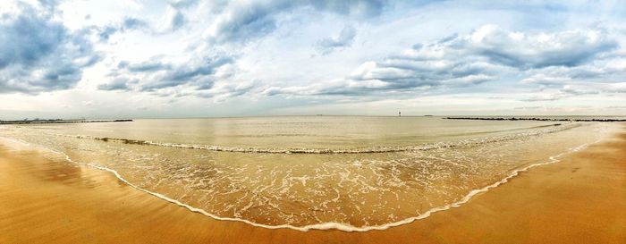 Scenic view of beach against sky