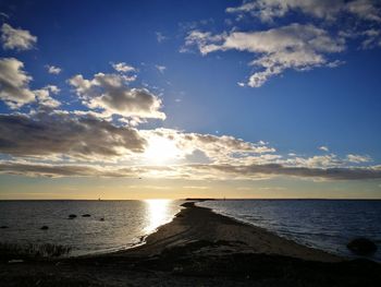 Scenic view of sea against sky at sunset