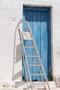 Ladder and closed door