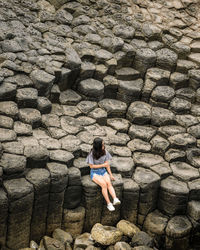 High angle view of woman on rocks