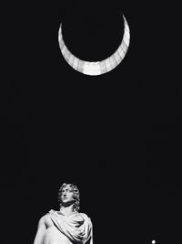 Low angle view of statue at night