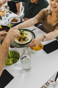 Group of friends eating mexican food at home