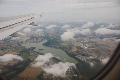 Aerial view of landscape seen through airplane window